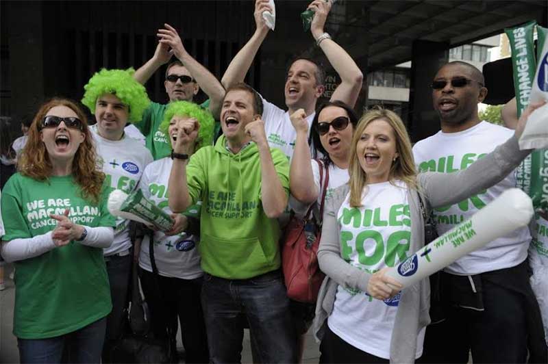 Boots staff cheer on Macmillan runners at the London Marathon
