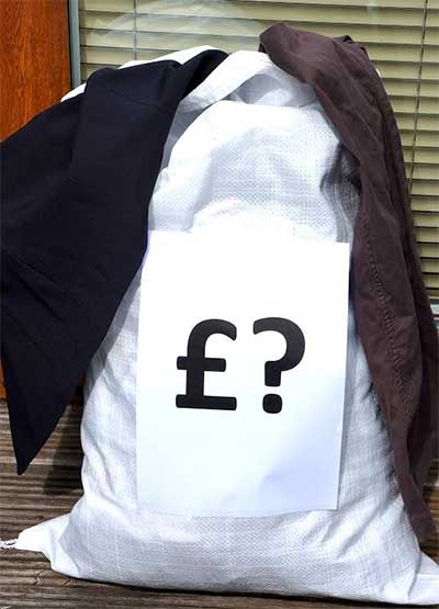 Donated clothes bag with question mark