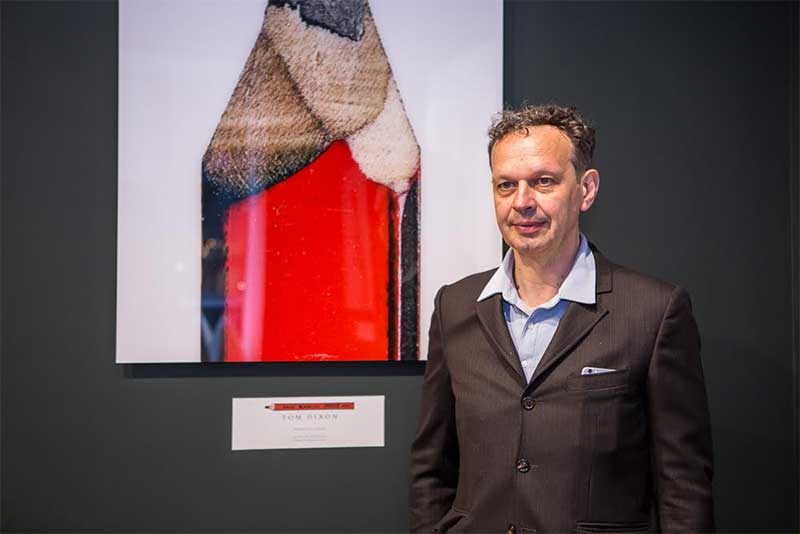 Tom Dixon with his design