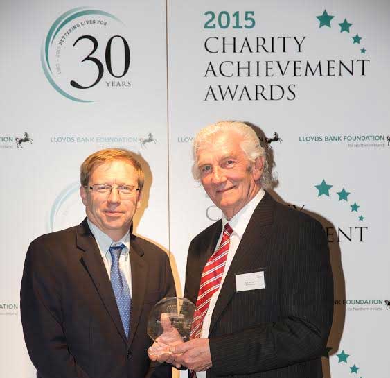 Paul Farmer presents Tom McAlpine with Charity Achievement Award. Photo: Tom Mellish